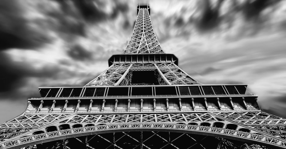 Tourists on a guided walking tour near the Eiffel Tower in Paris, France