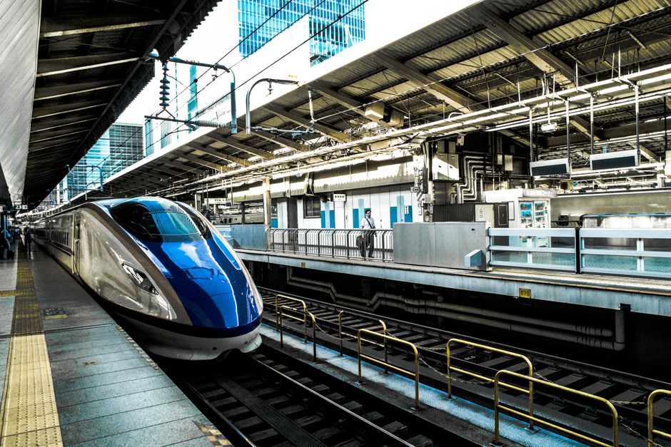 A sleek TGV high-speed train arriving at a modern station in France, symbolizing efficient intercity travel.