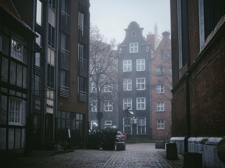 Historic street in a German city with traditional architecture and people walking