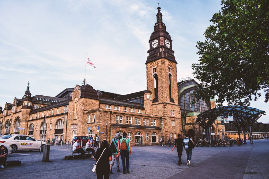 Busy street scene in a German city, reflecting daily life and urban costs