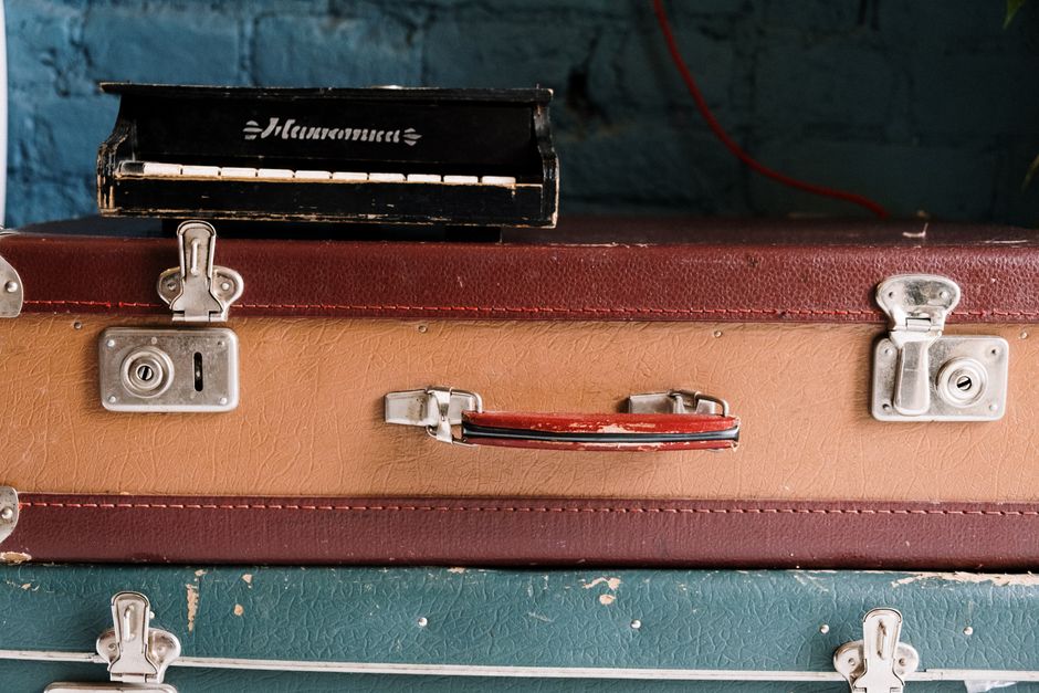 Open suitcase with clothes and travel essentials for a trip to Germany