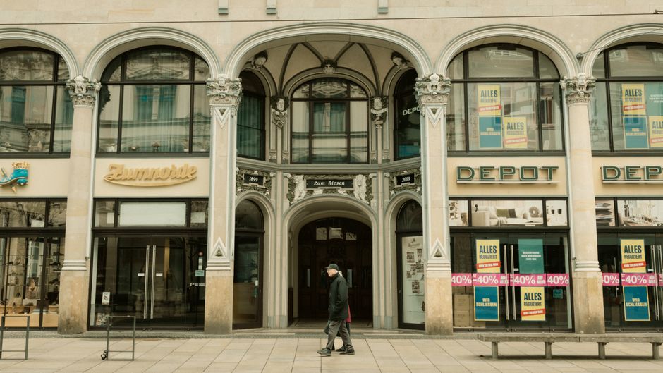 Tourist buying a prepaid SIM card in a German phone store