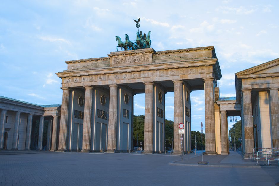 Tour group with guide in front of Brandenburg Gate in Berlin, Germany