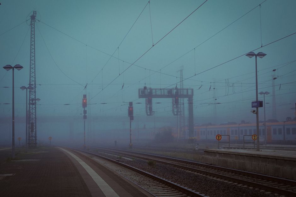 Busy German train station platform with a modern train, symbolizing efficient public transport in Germany