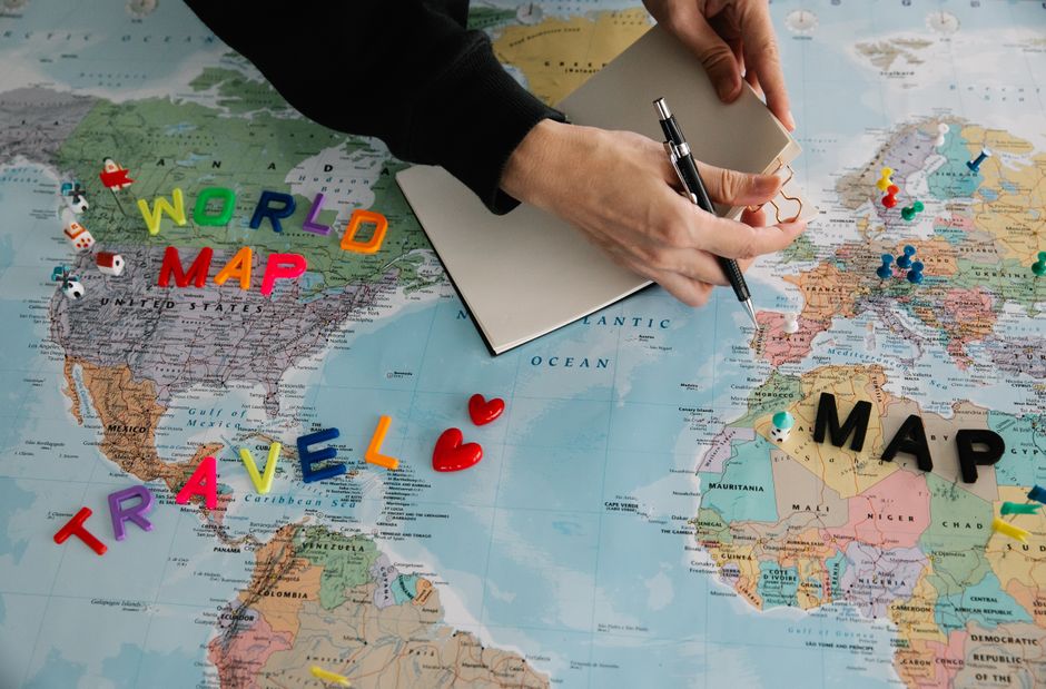 Traveler looking at a map of Argentina with iconic landmarks