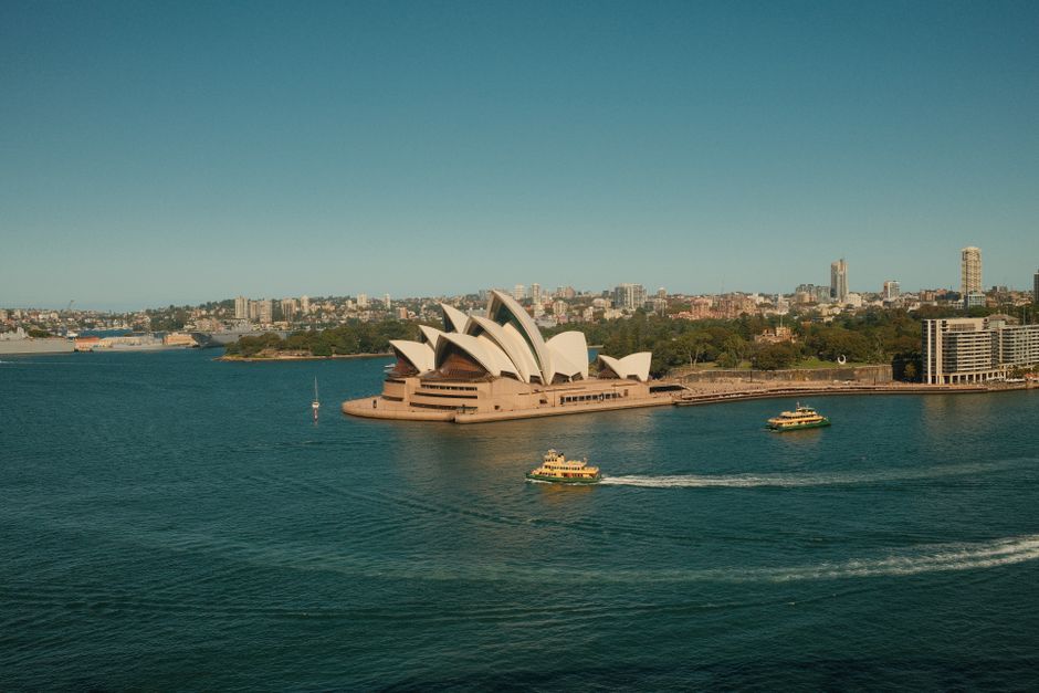 Iconic Sydney Opera House and Harbour Bridge in Australia at sunset