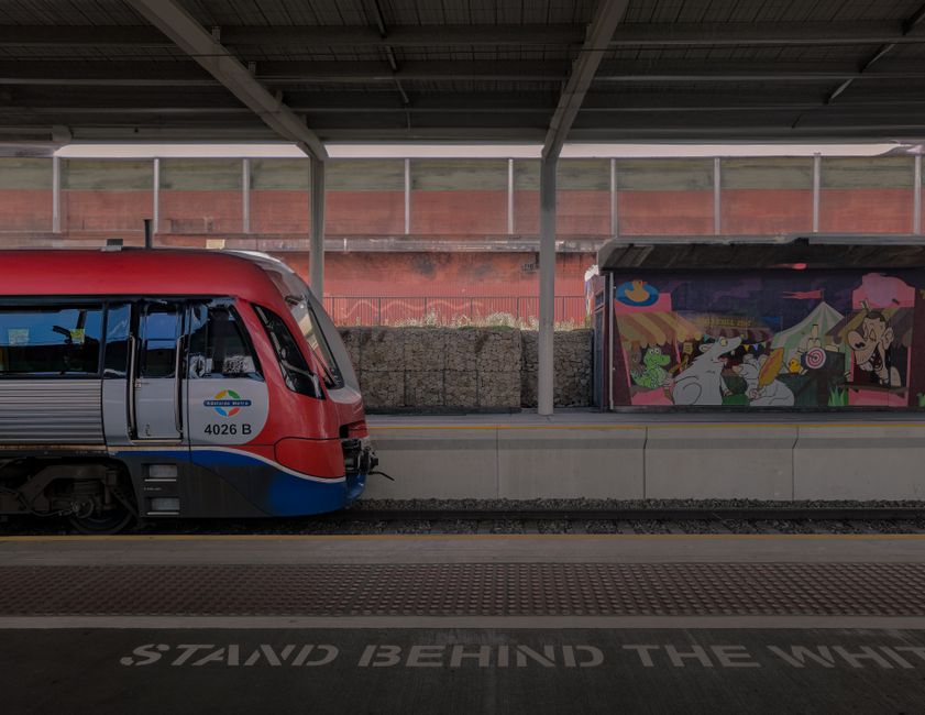 Modern Airport Link train arriving at a station in Sydney, Australia