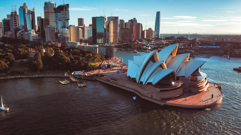 Sydney Opera House with a travel insurance policy overlay, symbolizing protection for Australian travels