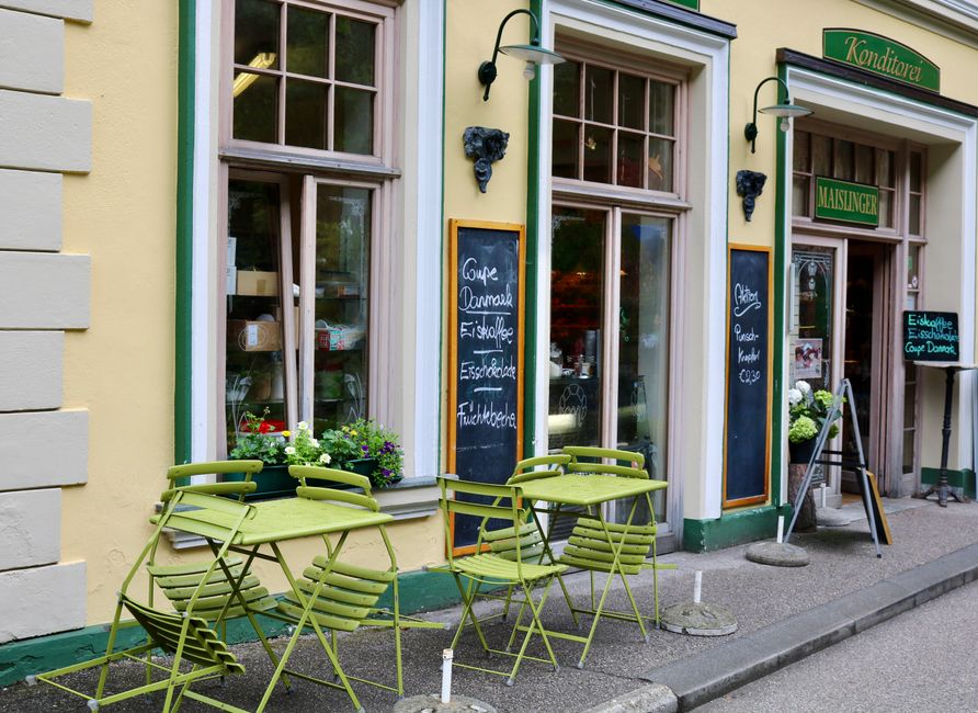 A classic Wiener Schnitzel with lemon and potato salad in a traditional Austrian restaurant setting