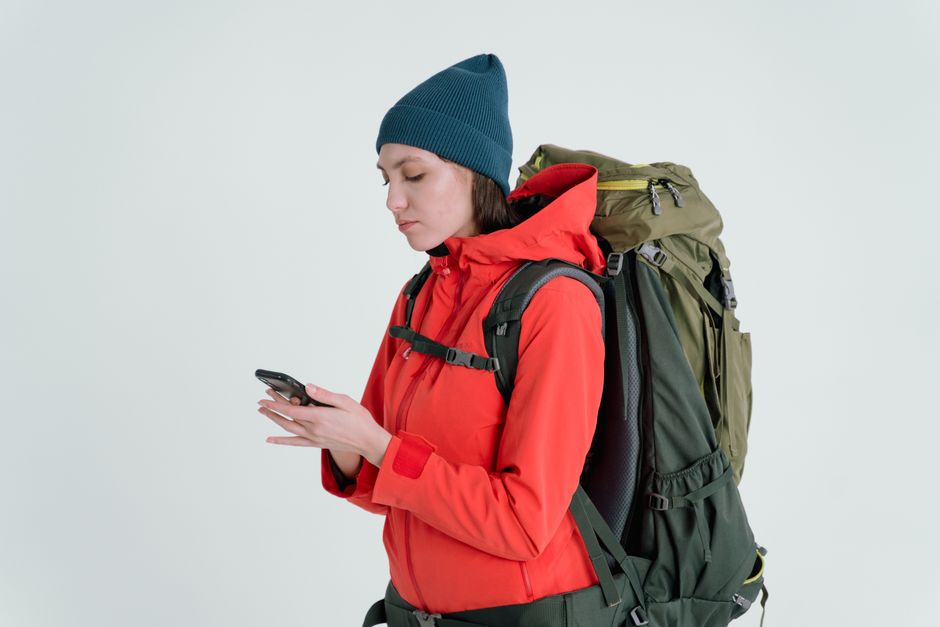 Traveler using a smartphone map app to navigate the streets of Vienna, Austria