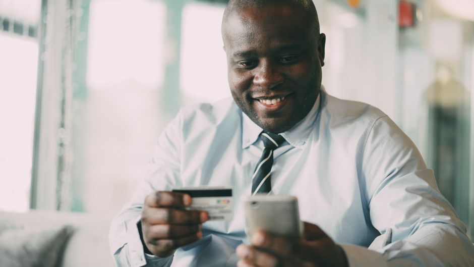 Traveler purchasing a prepaid SIM card in an Austrian mobile phone shop