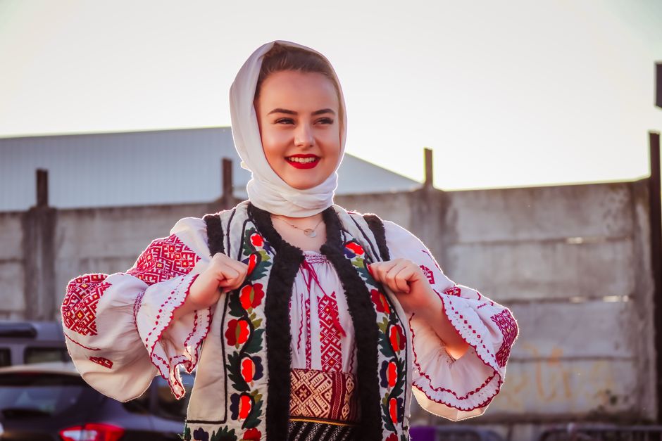 People in traditional Bulgarian costumes at a lively festival