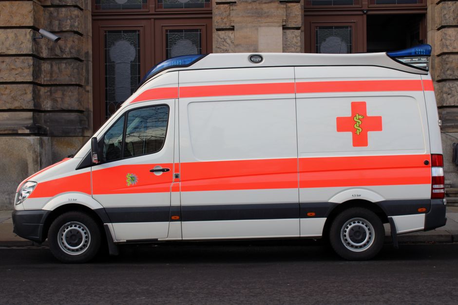 Emergency services vehicle with flashing lights in a Bulgarian city