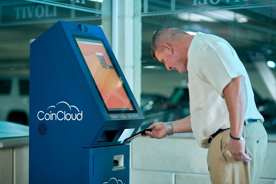 Tourist buying a prepaid SIM card at a kiosk in Sofia Airport, Bulgaria