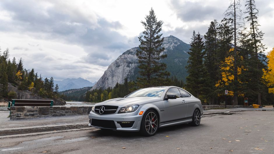 Car driving on a scenic highway in the Canadian Rockies