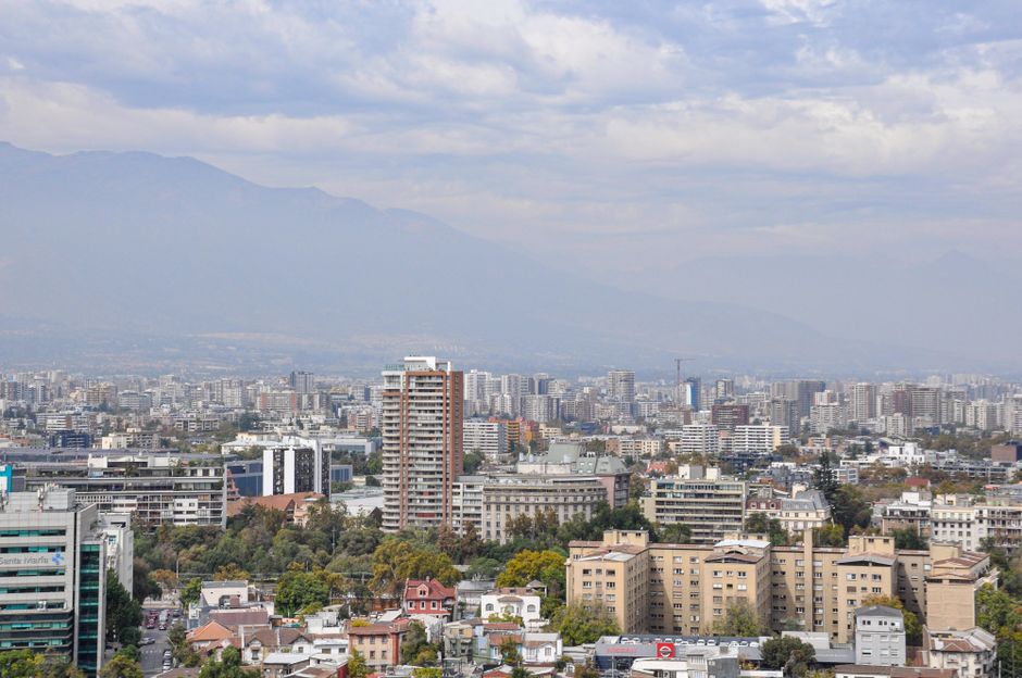 Panoramic view of Santiago, Chile at sunset with the Andes mountains in the background