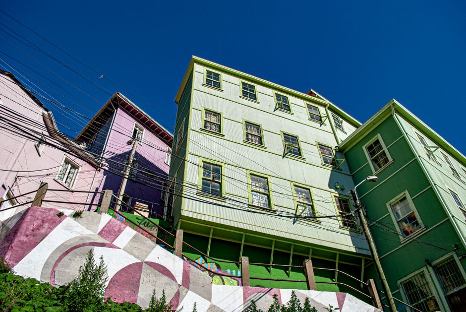 Colorful hostel facade in Valparaíso, Chile, with vibrant street art