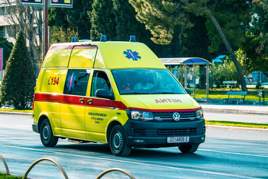 Emergency services vehicle in a Croatian city street, symbolizing safety and assistance for travelers.