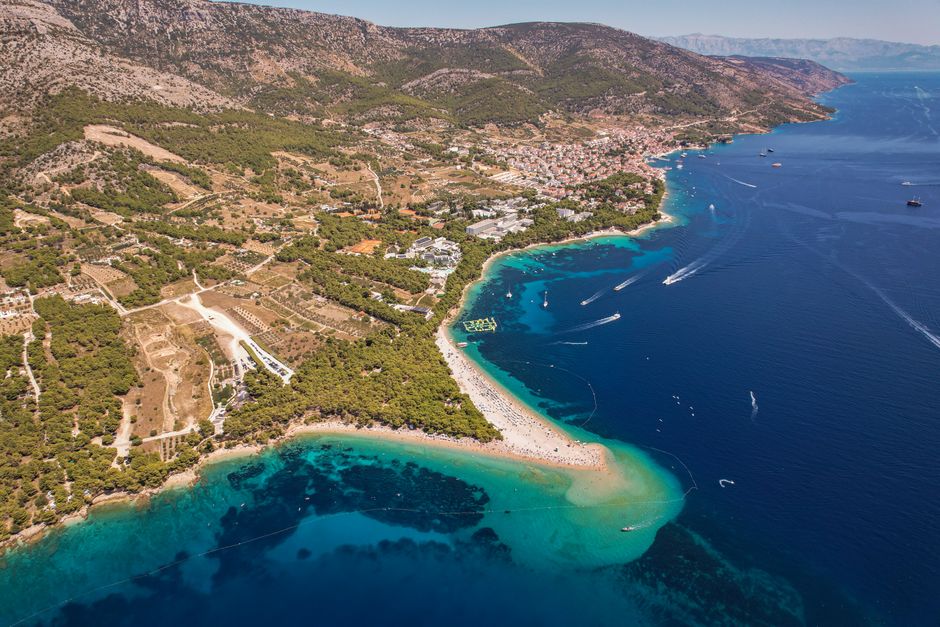 Stunning Croatian coastline with a tour boat sailing on the Adriatic Sea