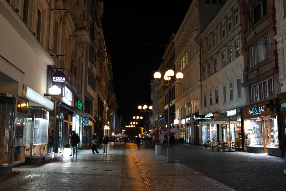 People walking and shopping on a bustling street in Prague, Czech Republic