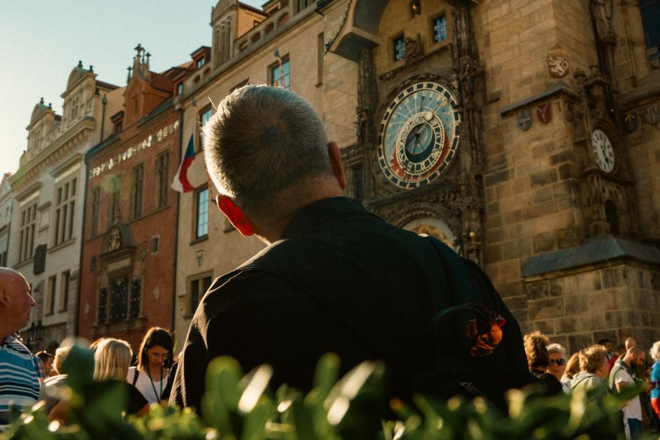 Tourists enjoying the historic Old Town Square in Prague, highlighting safe travel to the Czech Republic