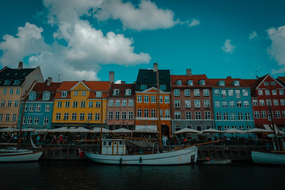 Colorful buildings along the Nyhavn canal in Copenhagen, Denmark, reflecting Danish culture