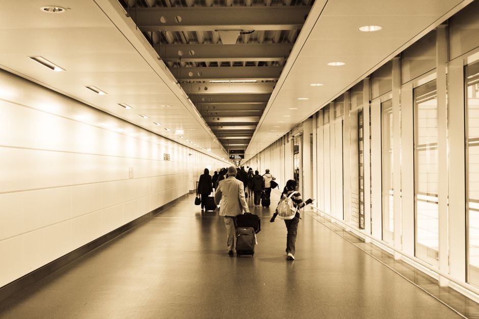 Modern terminal building at Copenhagen Airport, Denmark, with passengers