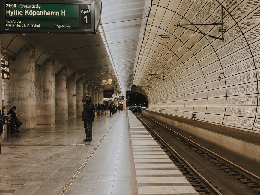 Modern Copenhagen metro station in Denmark with people waiting