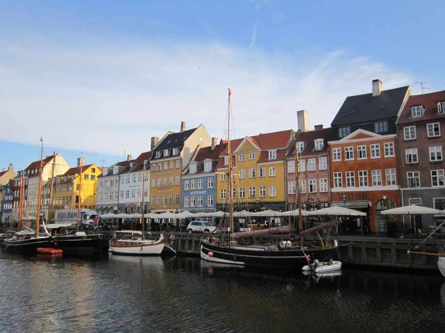 Colorful buildings along a canal in Copenhagen, Denmark, on a pleasant summer day