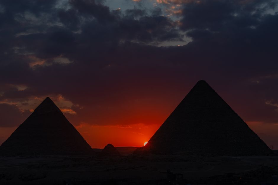 Sunrise over the Giza Pyramids complex in Egypt, a popular day trip destination from Cairo