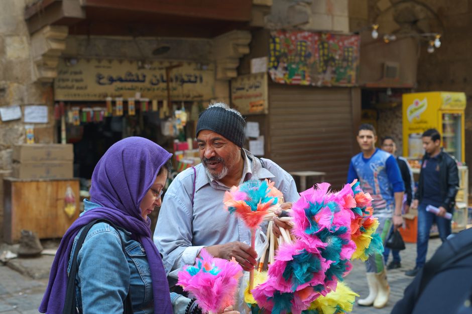 Bustling Khan el-Khalili Bazaar in Cairo, Egypt, with colorful stalls and shoppers