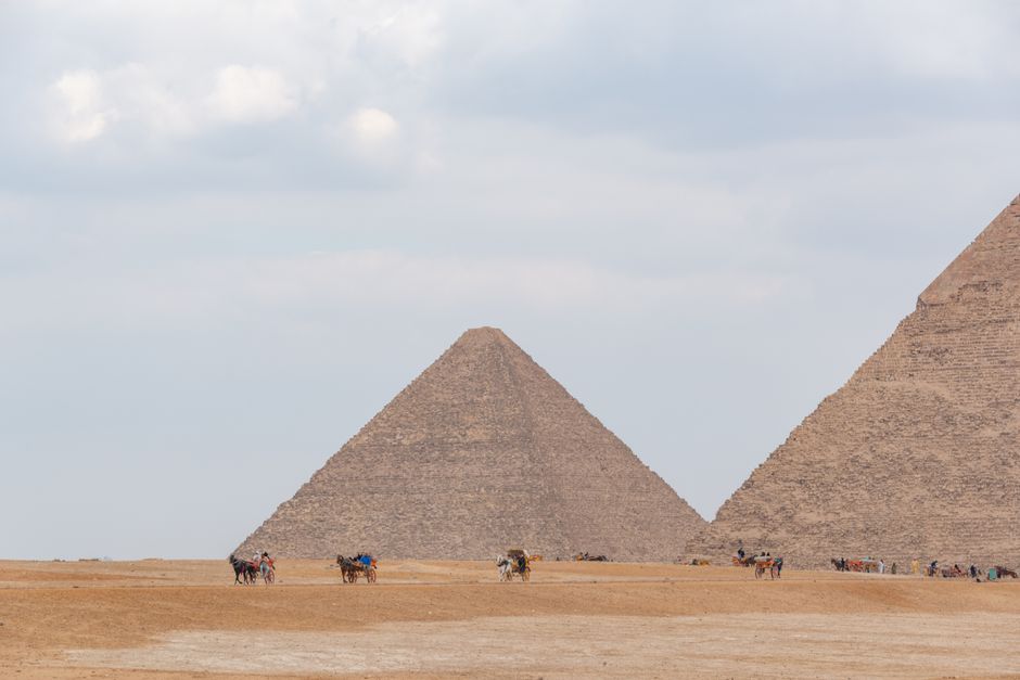Traveler looking at the Pyramids of Giza in Egypt, symbolizing a protected and worry-free trip