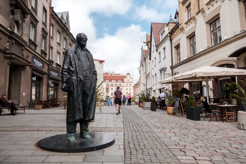 Charming cobblestone street in Tallinn Old Town, Estonia, bustling with travelers