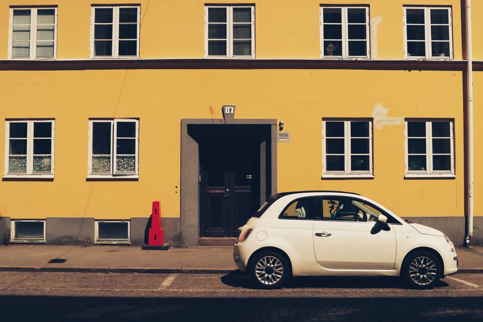 Rental car driving on a scenic road in the Estonian countryside
