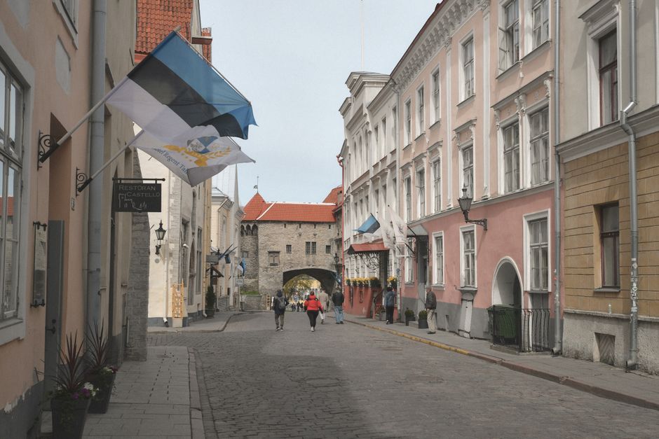 A vibrant shopping street in Tallinn's Old Town, Estonia, with local boutiques and historic architecture