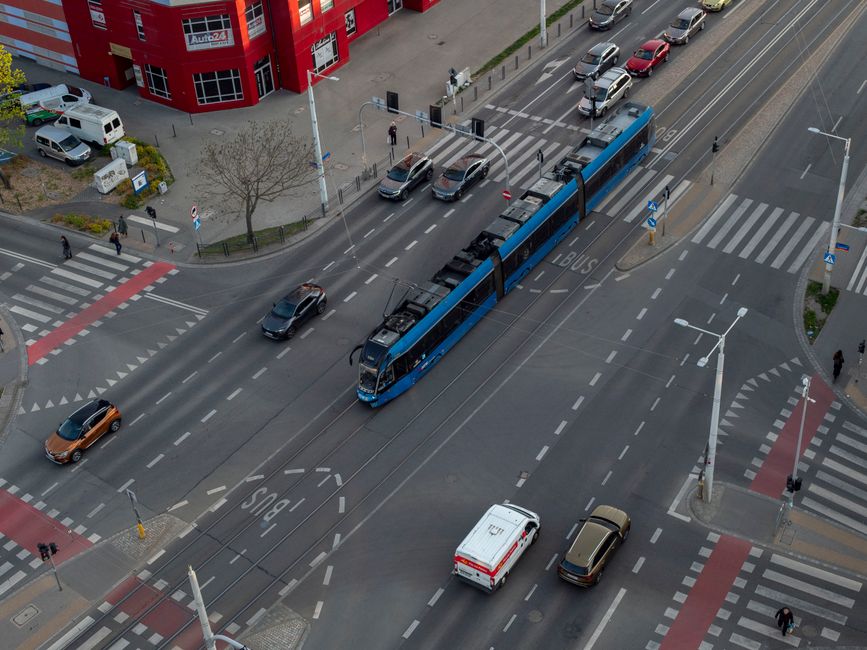 Modern tram in Tallinn, Estonia, with historic buildings in the background