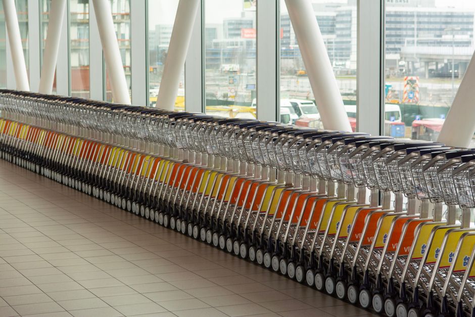 Modern terminal interior of Helsinki-Vantaa Airport in Finland with passengers
