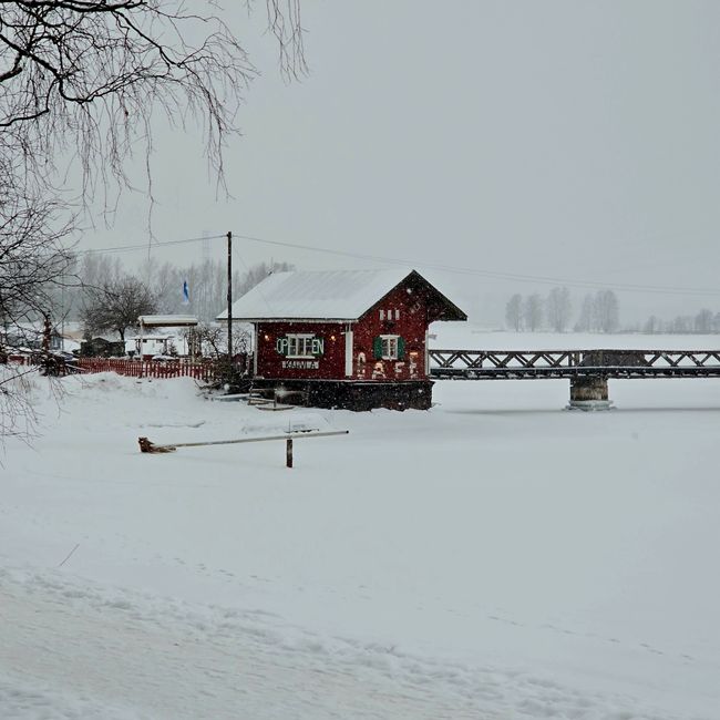 Colorful wooden houses along the river in Porvoo, Finland, a popular day trip destination.