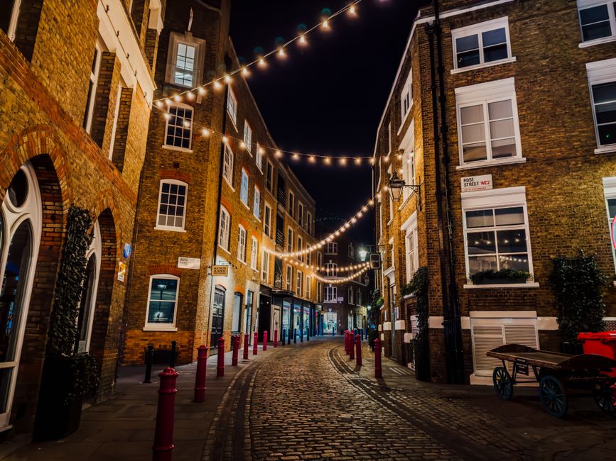 Bustling street in a major Great Britain city, showing typical daily life and costs