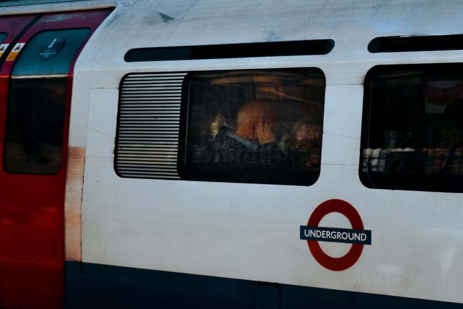 Busy London Underground station platform with diverse commuters