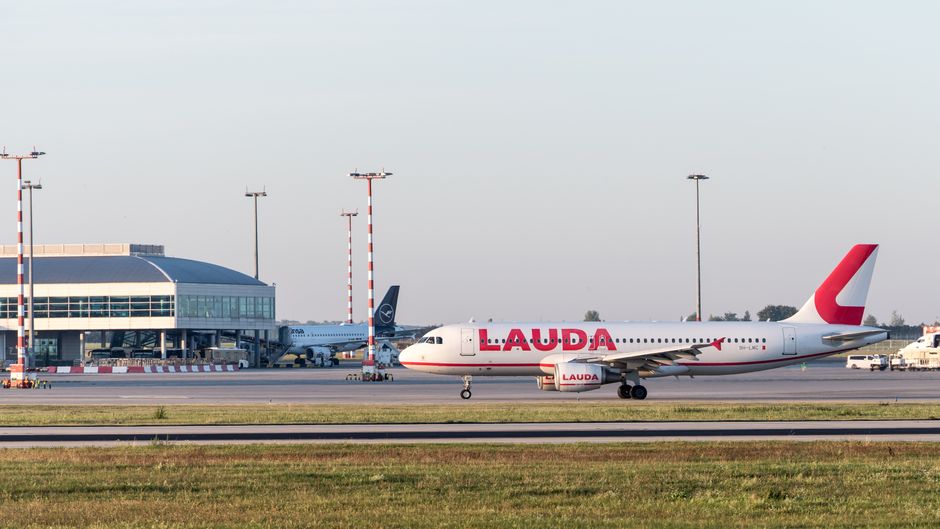 Departure board at Budapest Ferenc Liszt International Airport showing flight delays in Hungary