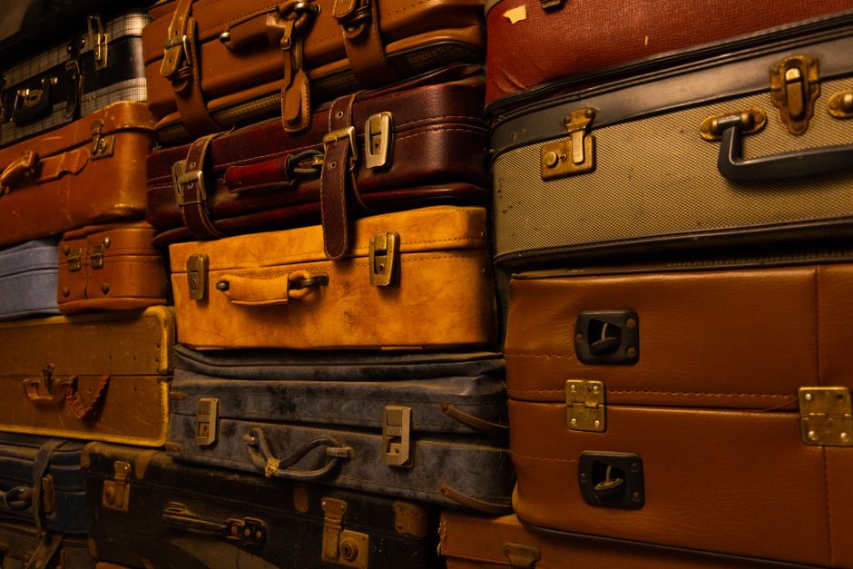 Open suitcase with clothes and travel essentials for a trip to Hungary