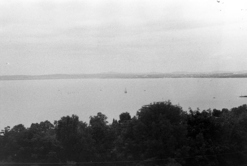 Panoramic view of Lake Balaton in Hungary with sailboats and green hills