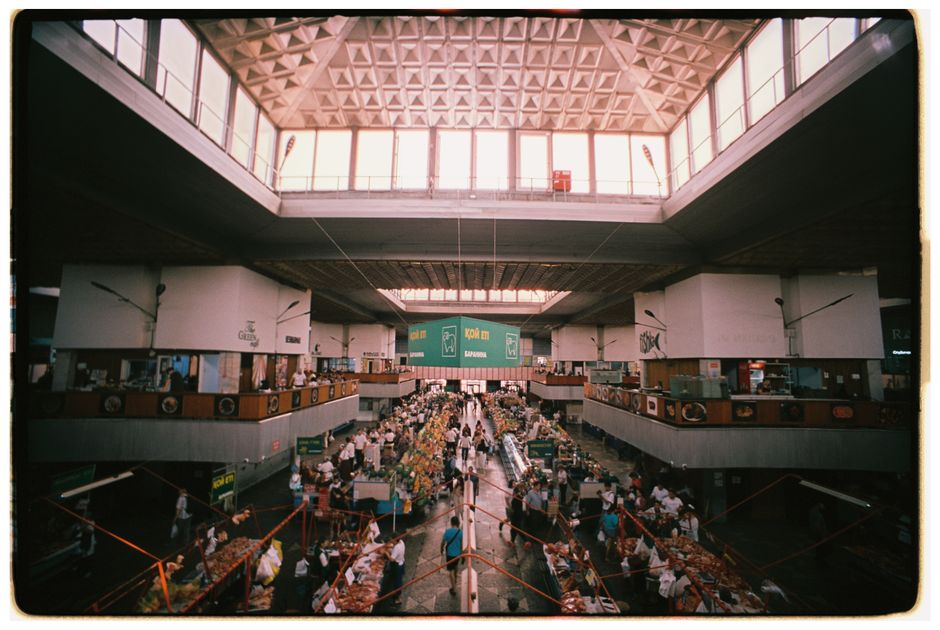 Interior view of the historic Great Market Hall in Budapest, Hungary, with stalls selling local produce and souvenirs.
