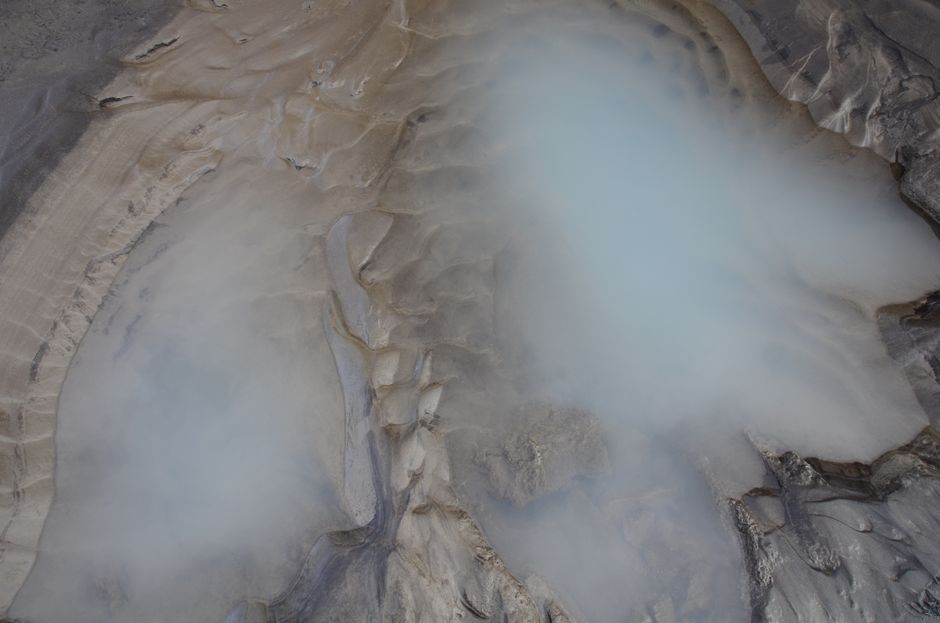 People relaxing in the milky blue waters of the Blue Lagoon geothermal spa in Iceland
