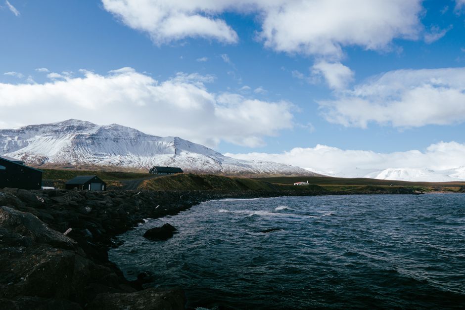 Tour bus driving through the scenic Golden Circle route in Iceland