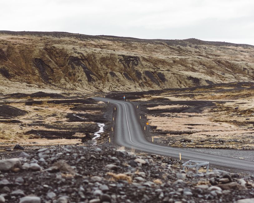 Traveler enjoying a scenic view in Iceland, symbolizing peace of mind with travel insurance