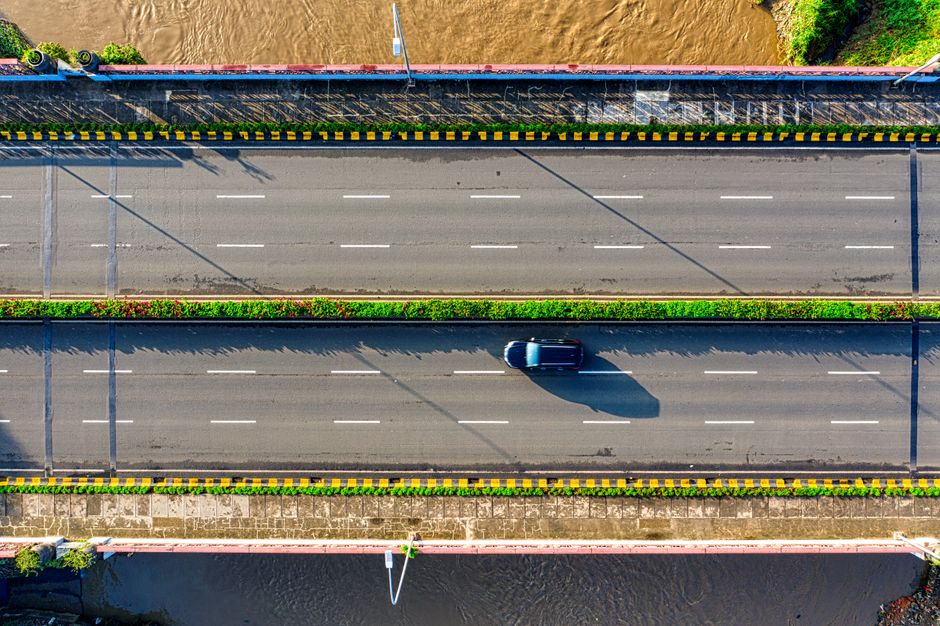 Modern car driving on a scenic highway in India