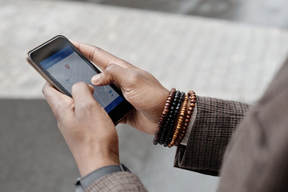 Traveler looking at a map on a smartphone in a bustling Indian street