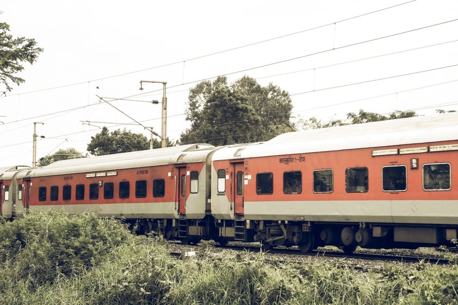 High-speed Vande Bharat Express train arriving at an Indian railway station